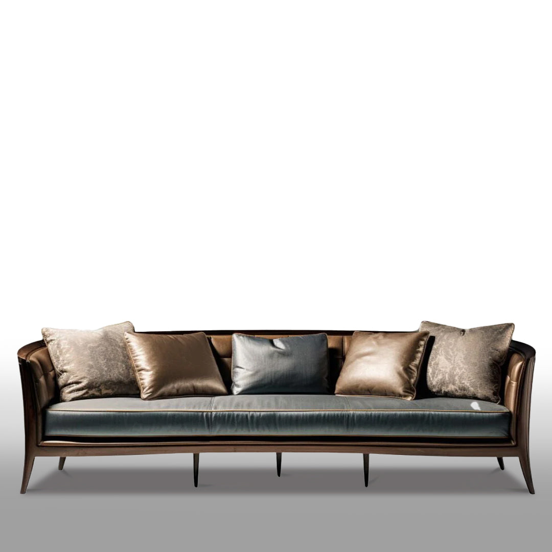 Ekant sofa with a sculpted wood frame, muted blue upholstery and layered cushions